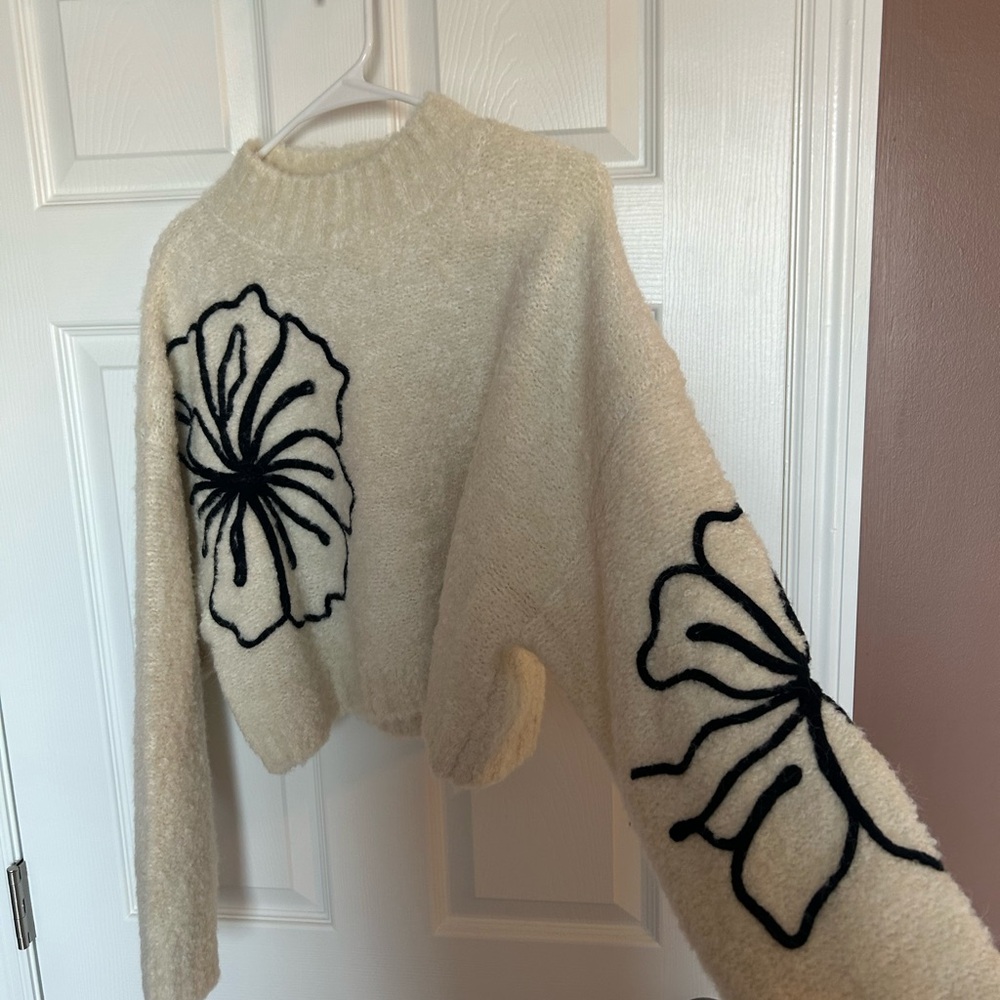 Pink Lily Boutique- Blown Again ivory and black large floral mockneck sweater